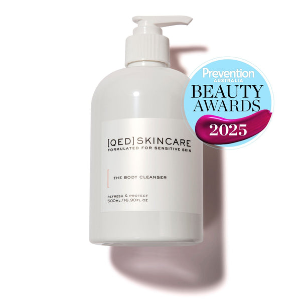 White pump bottle with skincare label and award seal.