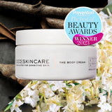 White cylindrical jar of qed body cream with cinnamon leaf for sensitive skin perfect for limited sale use